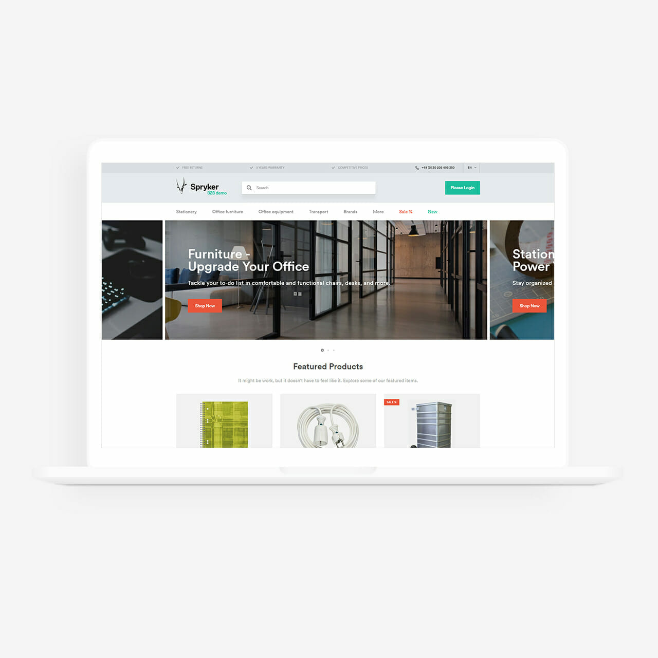 A laptop displaying a website homepage for Spryker, an office furniture store, featuring a banner to "Upgrade Your Office" and a section with featured products. The sleek design shares similarities with top eCommerce platforms like Magento.