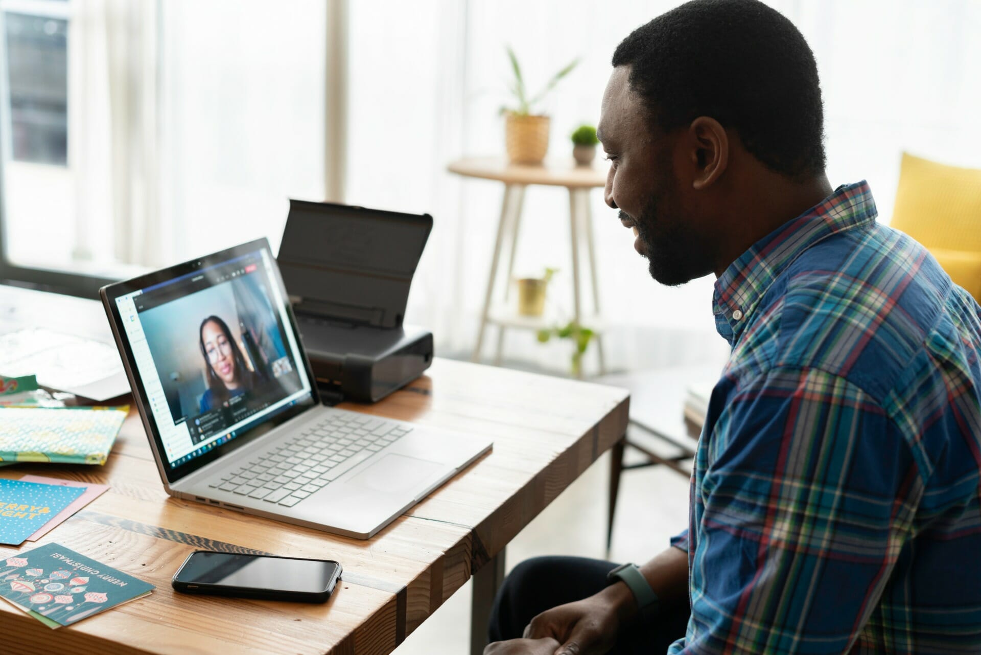 Man in meeting on laptop