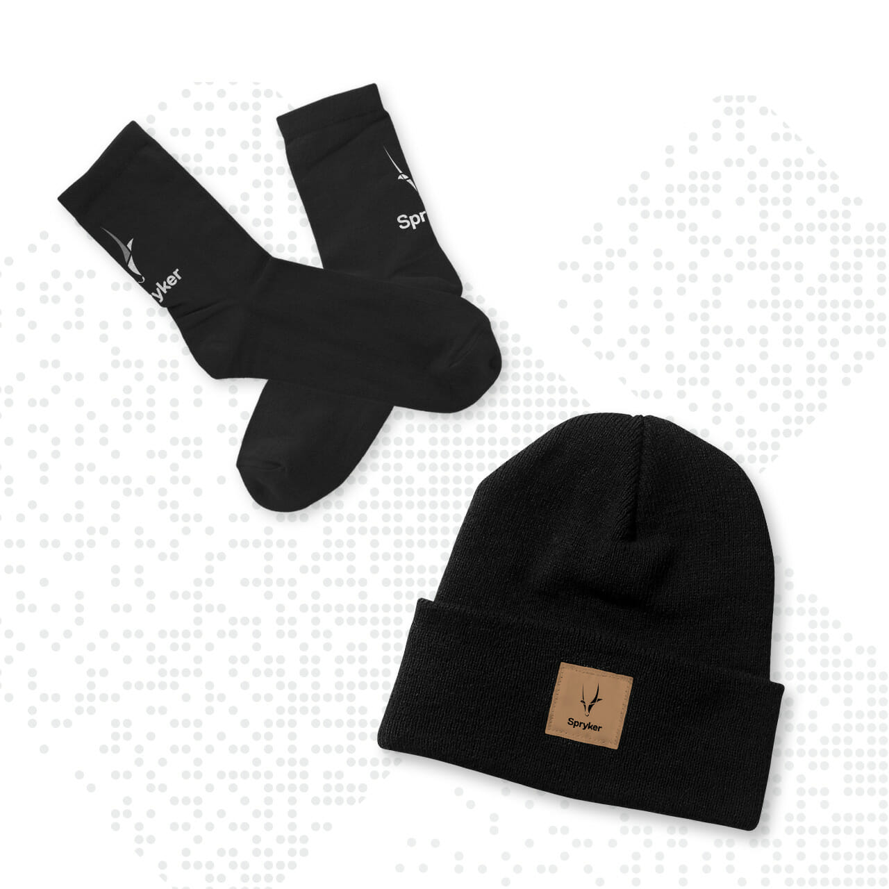 Black socks with a white logo and a black beanie with a leather patch, showcased on a white background with a dotted pattern. Perfect for businesses looking to bulk order stylish accessories through B2B Online Europe.