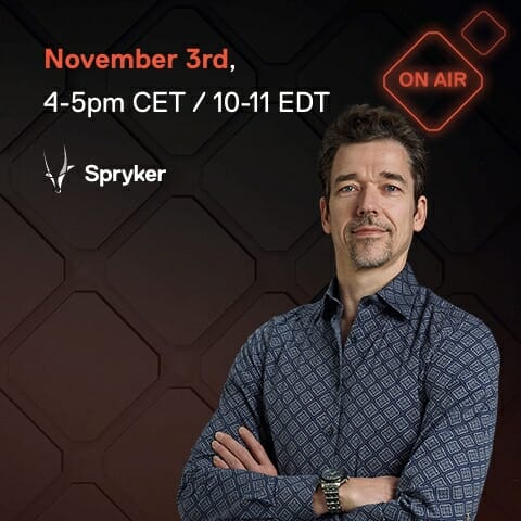 Man in patterned shirt standing with arms crossed next to text "November 3rd, 4-5pm CET / 10-11 EDT," "Spryker" logo, and illuminated "ON AIR" sign. Background features a striking geometric design.