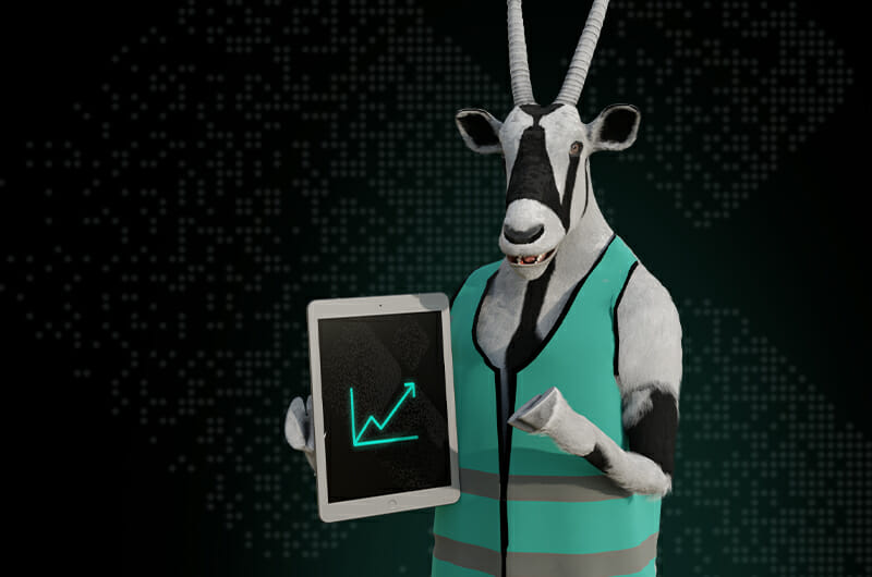 A goat standing upright, wearing a green vest, holds a tablet displaying an upward-trending graph—symbolizing growth in B2B manufacturing.