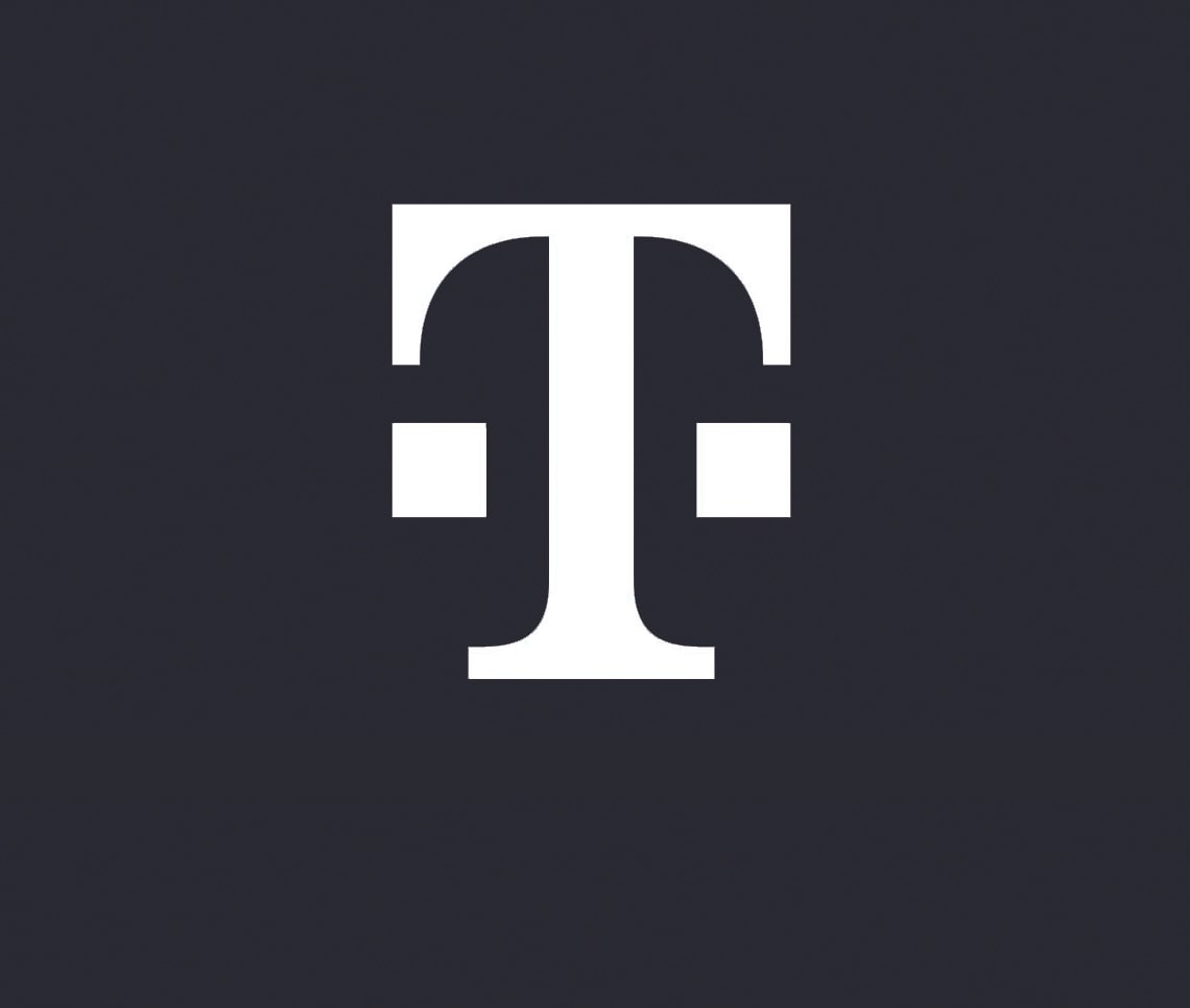 The image shows a white, stylized "T" logo on a dark background. The letter "T" has two horizontal bars, one on each side of the vertical stroke, near the top. The design is minimalistic with clean lines.