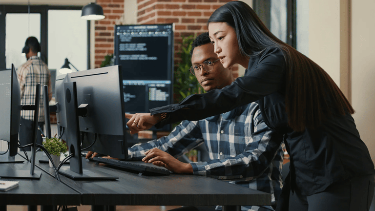 office-workers-looking-at-computer-screen