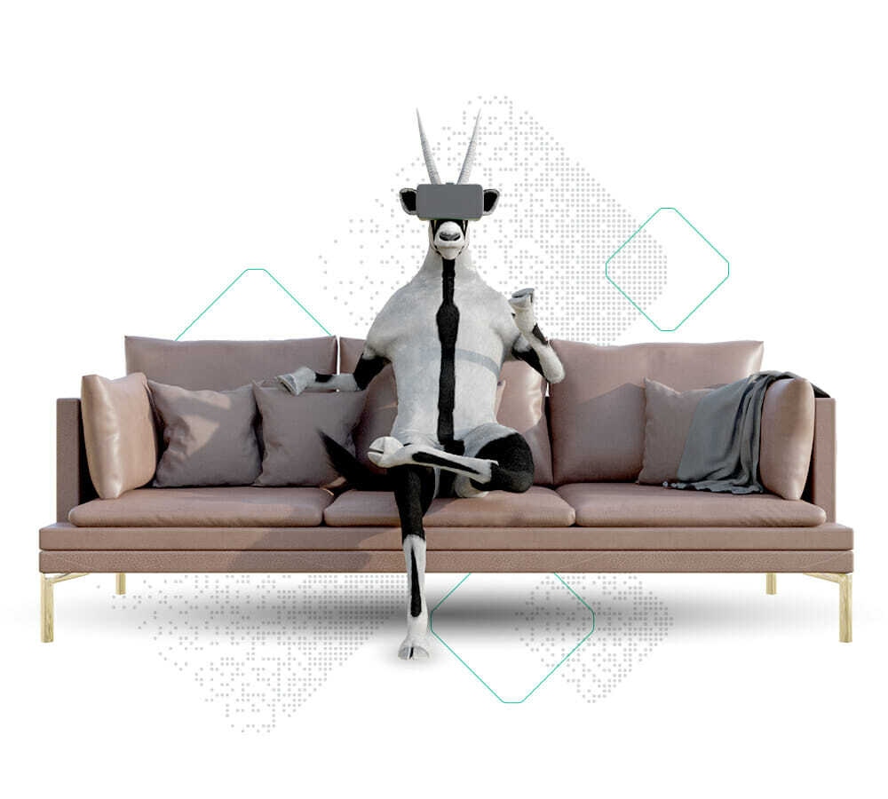 An anthropomorphic goat, fully immersed in a VR headset and gripping a controller, sits on a modern sofa adorned with pillows and a blanket, epitomizing the mantra: Stay Competitive With Visual Commerce.